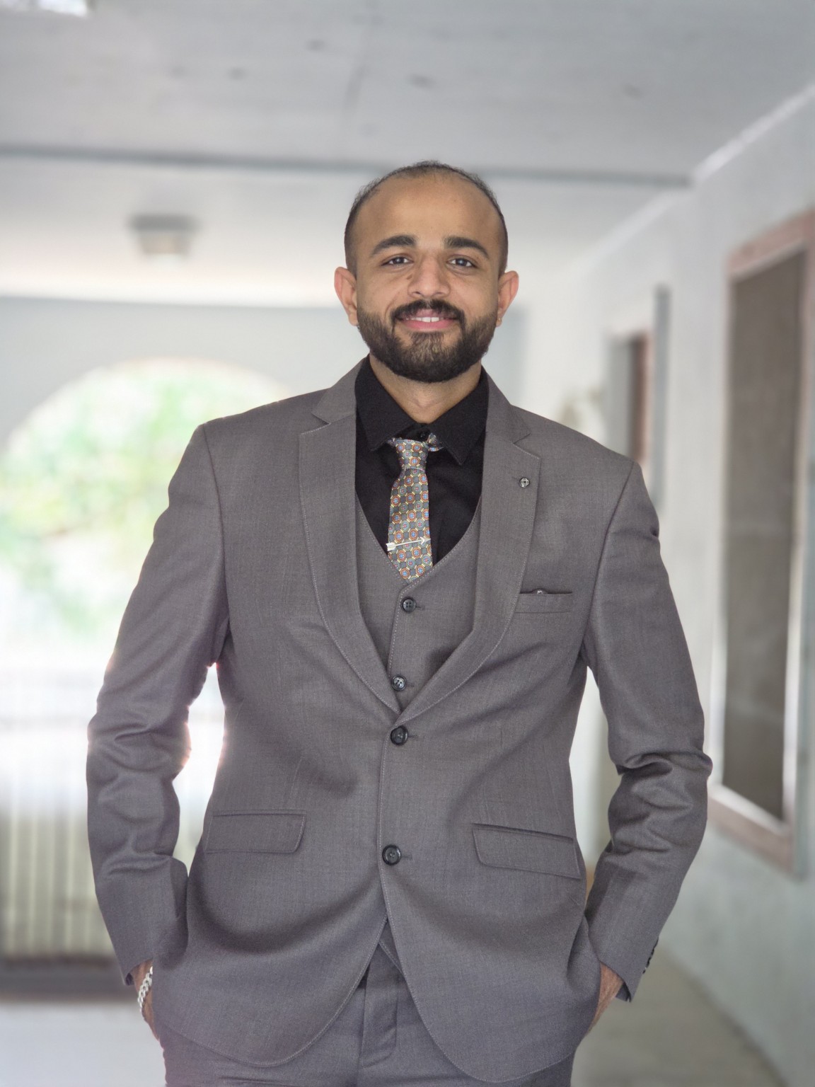 Hemant Sharma in a professional suit